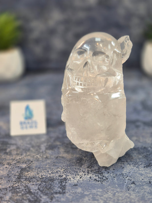 Hand Carved Clear Quartz Skull on Natural Cluster Base
