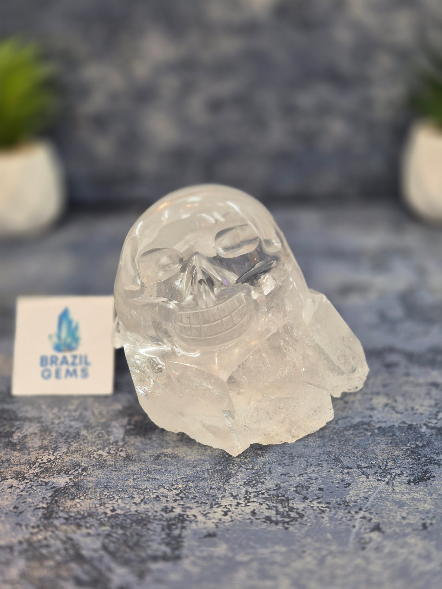 Hand Carved Clear Quartz Skull on Natural Cluster Base