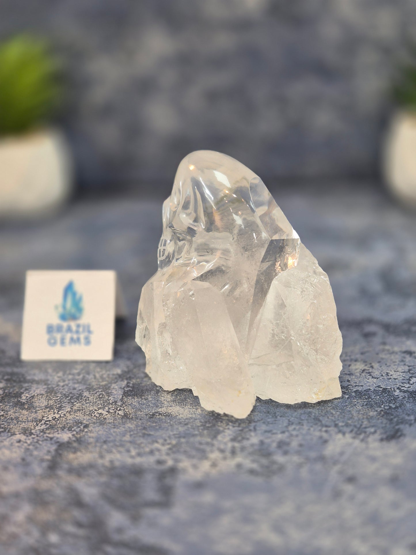 Hand Carved Clear Quartz Skull on Natural Cluster Base