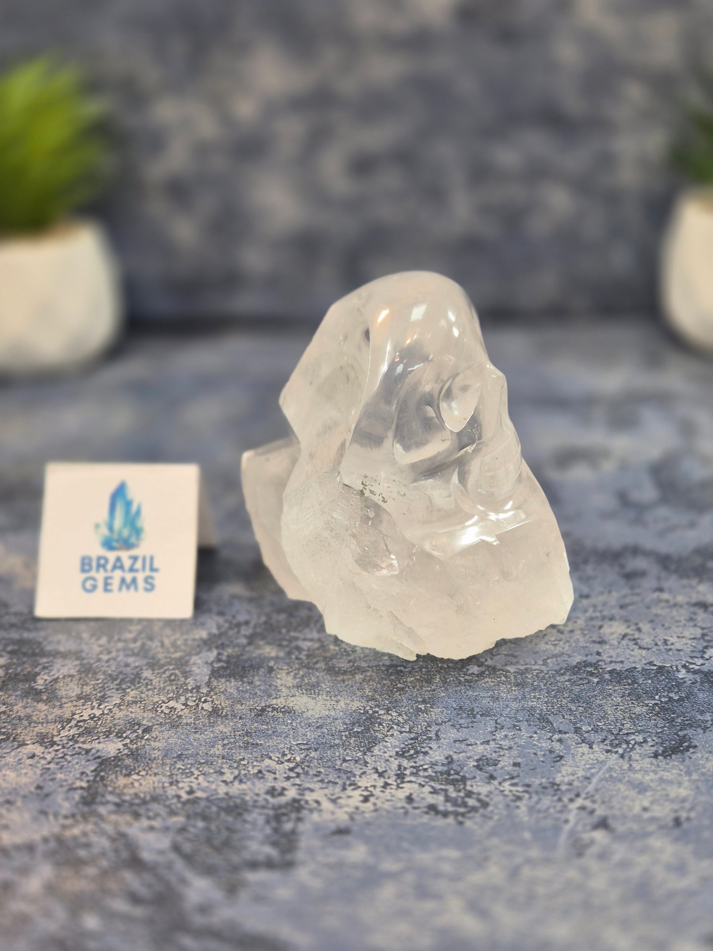 Hand Carved Clear Quartz Skull on Natural Cluster Base