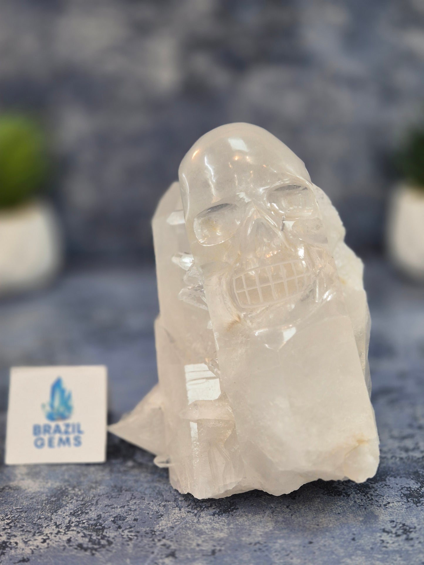 Hand Carved Clear Quartz Skull on Natural Cluster Base