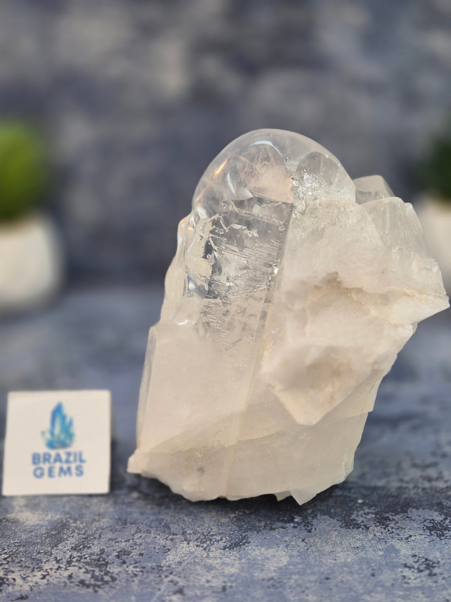 Hand Carved Clear Quartz Skull on Natural Cluster Base