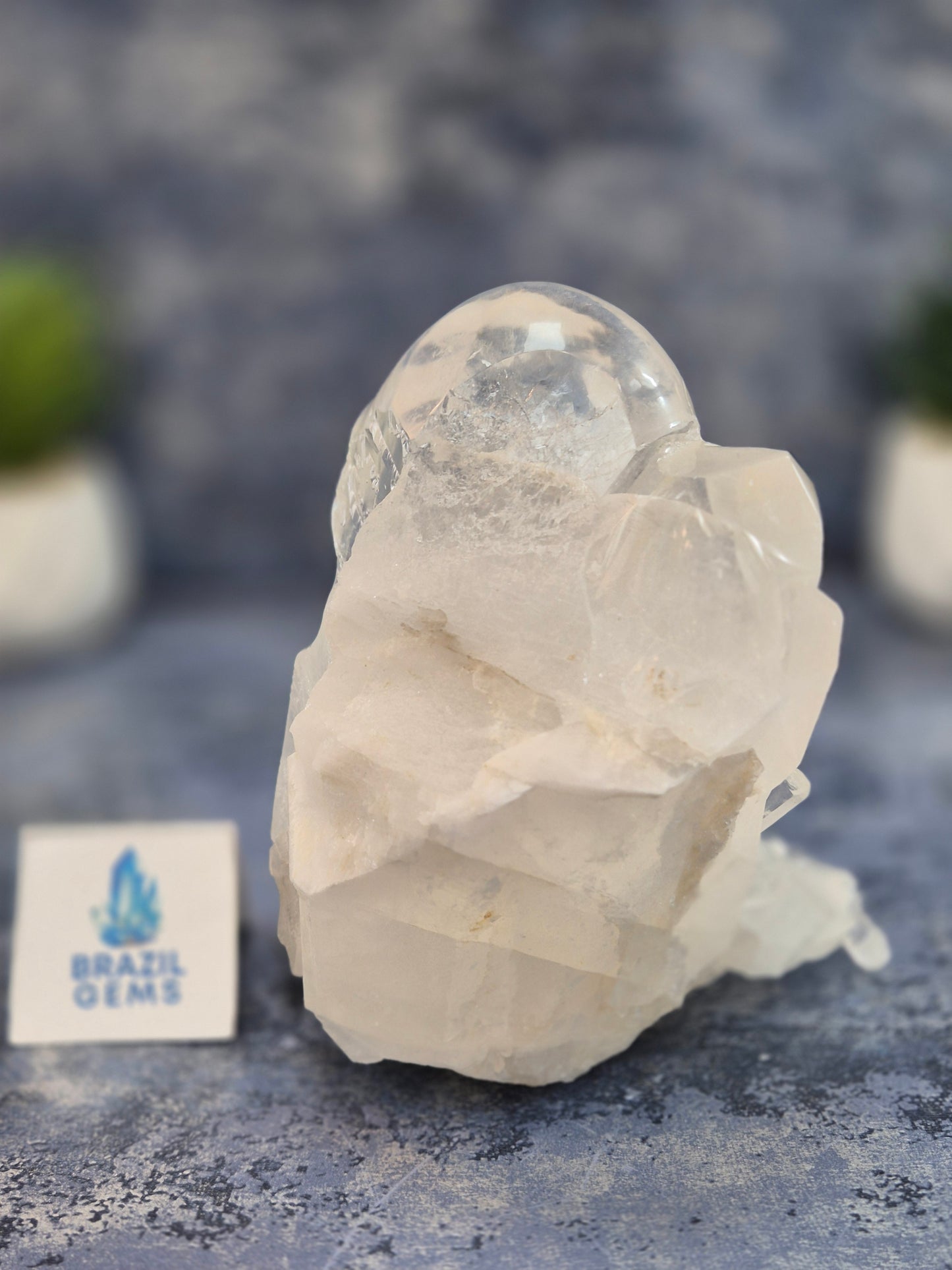 Hand Carved Clear Quartz Skull on Natural Cluster Base