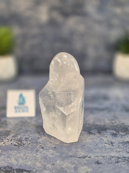 Hand Carved Clear Quartz Skull on Natural Quartz Base